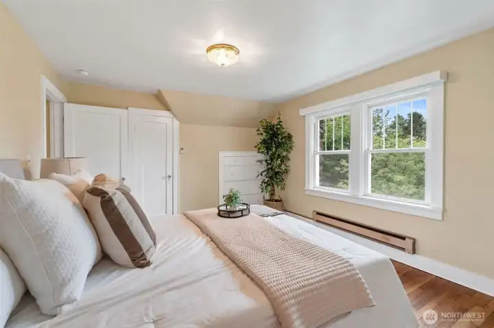 Primary bedroom with built-in dresser. Primary bedroom with built-in dresser.