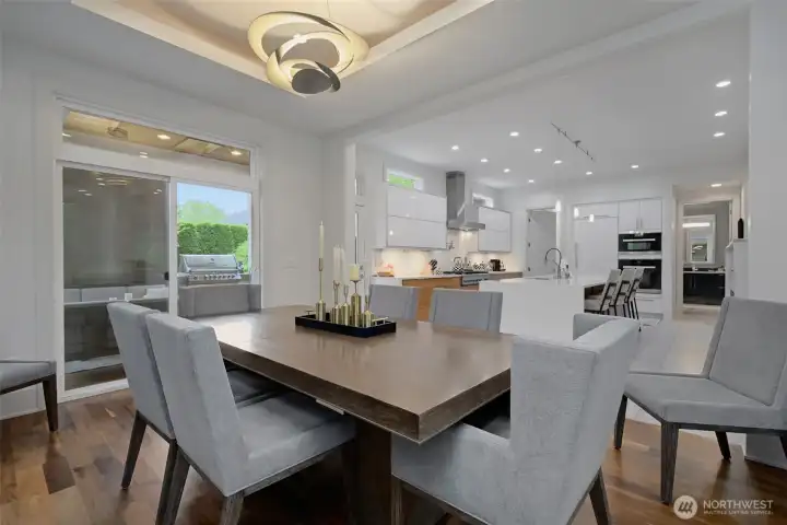 Gorgoues warmth meets form and function in this dining room that opens to the back patio and kitchen.
