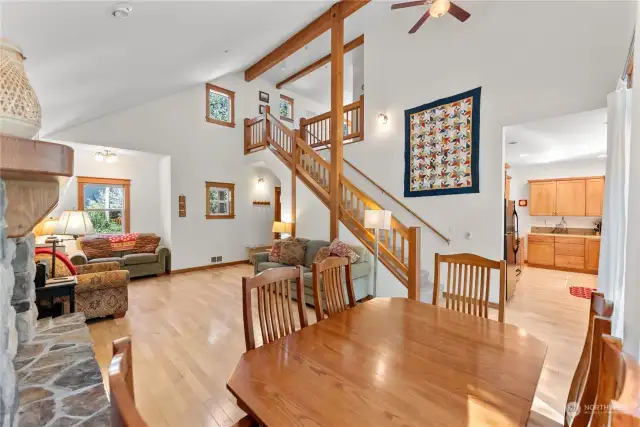 Great room. High ceilings, fan, timber features elevate the cabin character.