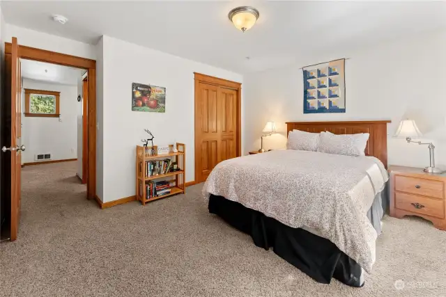 Upper Bedroom 2 is carpeted and bright with South facing windows.