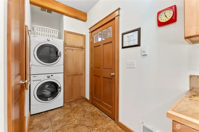 Stack washer/dryer in Utility area off of Kitchen.