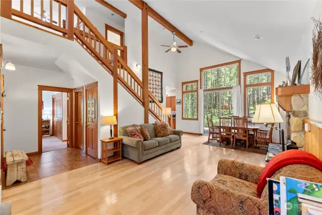 Great room comfort with gleaming honey maple hard-wood floors & timber features.