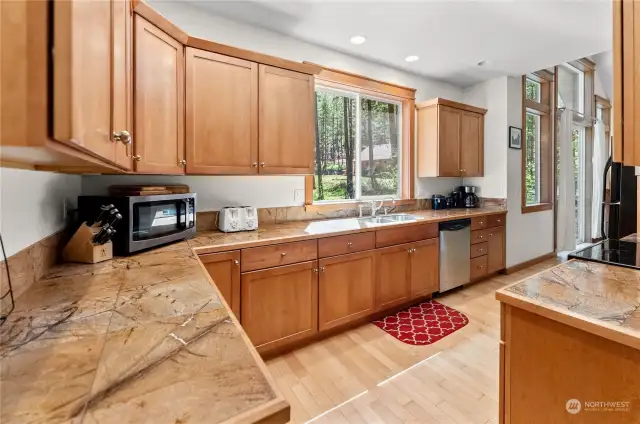 Well appointed kitchen and beautiful sunlit mornings are yours at Bear Paw cabin. All appliances included. Ceramic tile counter matched with wood trim & cabinets. Hardwood floors.