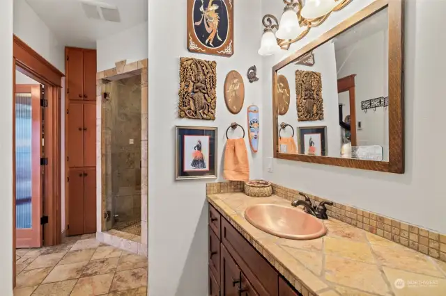 Main bath in the MIL Suite features custom tile and