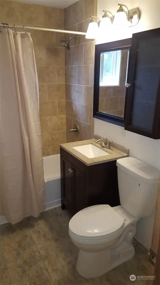 Redone bathroom a few years back. This is Unit B (Reid Ave address)