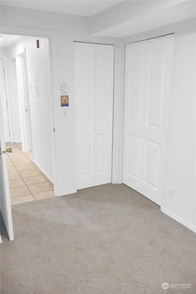 Another view of the bedroom closet with the doors closed.