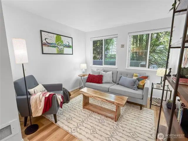 The living room is a good size with plenty of natural light from the two large windows. The bump out offers additional space and allows for multiple room configurations.
