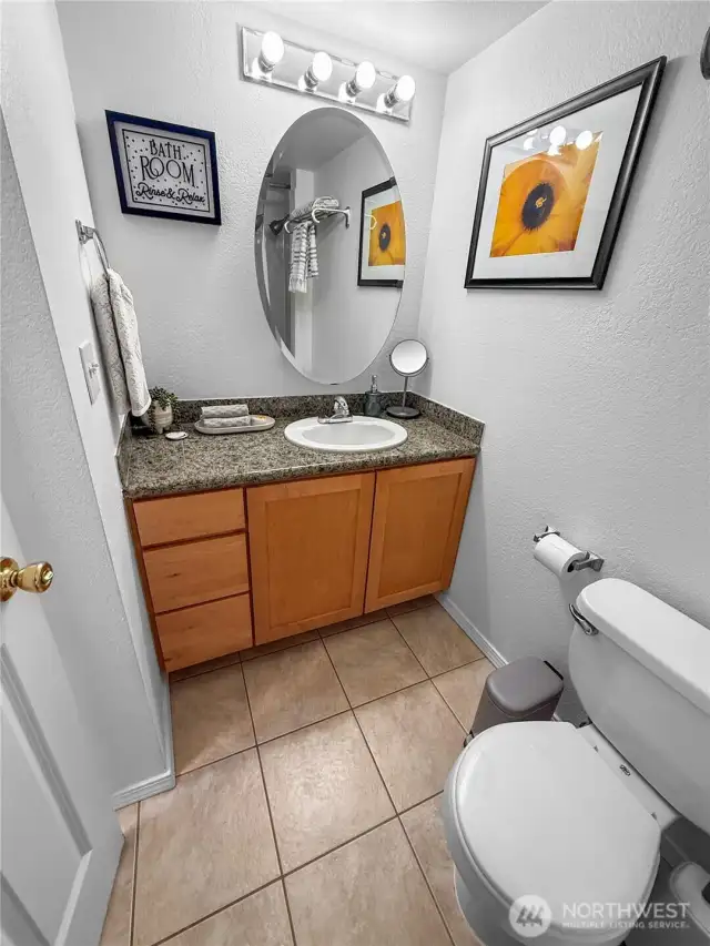 Plenty of counterspace and cabinets. The mirrors swings open to access a medicine cabinet.