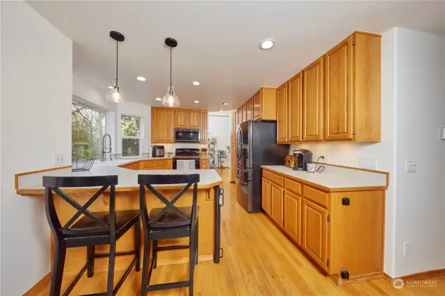 Look at the amazing storage in this kitchen! Light and bright.