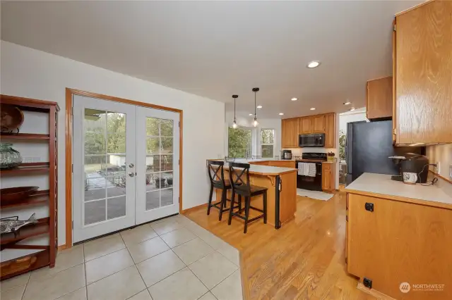 Brand new french doors lead to the covered patio.