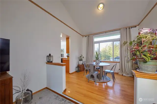 Dining area with oak floors.