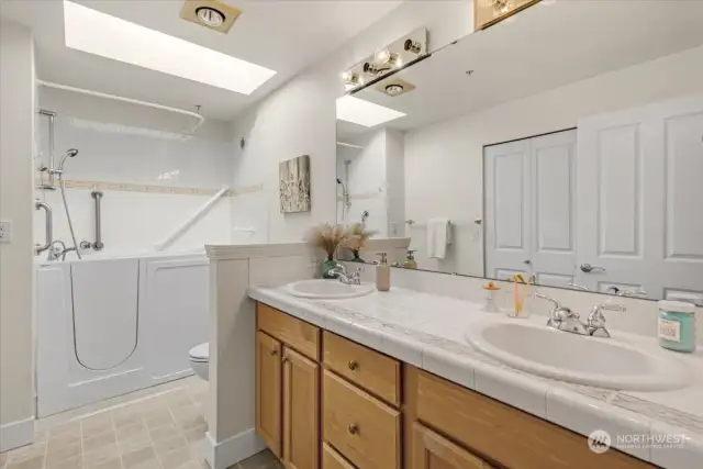 The primary bath boasts double vanity for lots of counter and storage space.  There is also a large walk-in closet not showing.