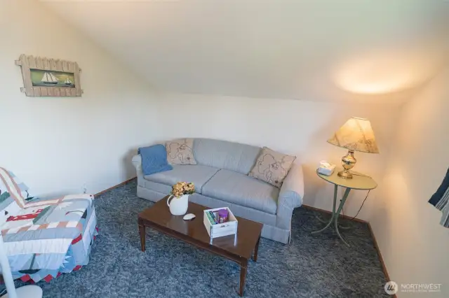 Living room at the top of the stairs.