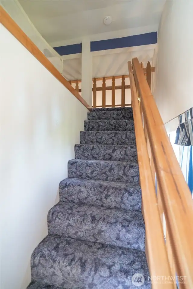 Another flight of stairs to the loft bedroom.