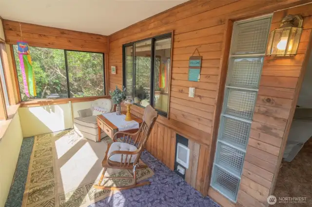 Sun room with a lot of windows for natural light.