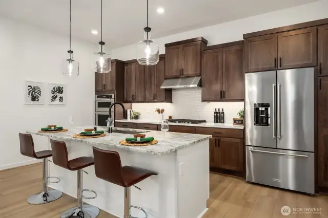 Kitchen with modern pendant lighting over island