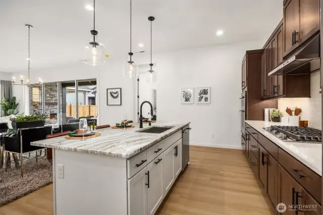 Quartz countertops on perimeter and island