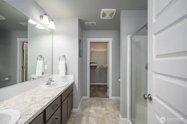 The primary bath features a double vanity and large shower.