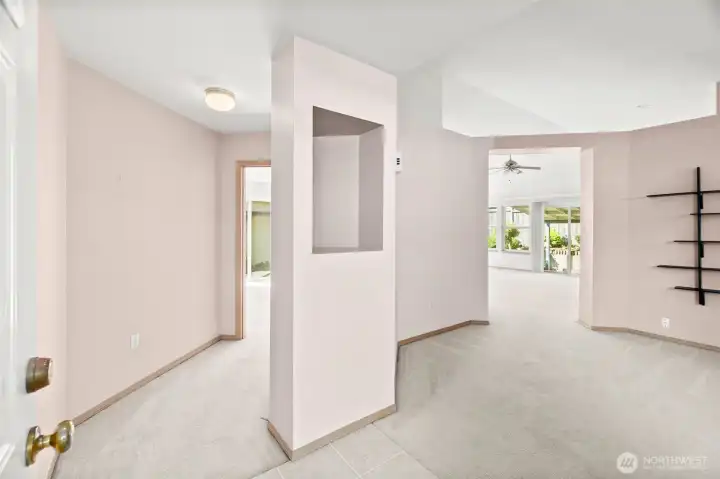 Hallway to private primary bedroom & bathroom