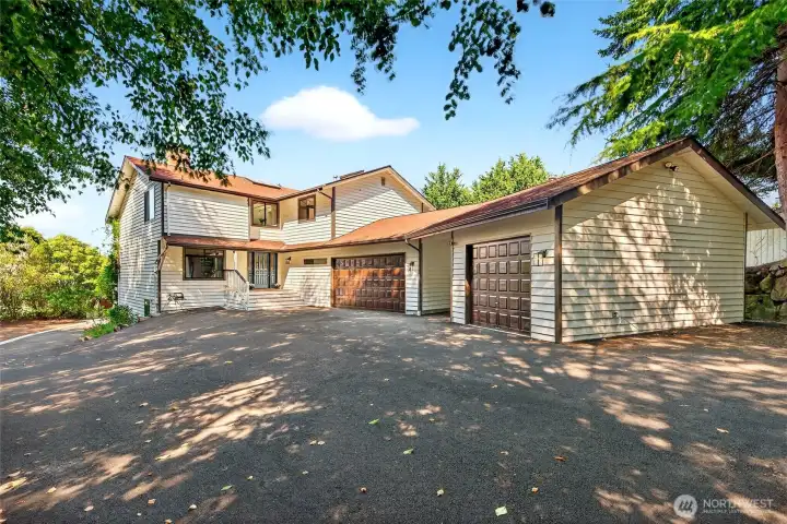View of house and 3 car garage