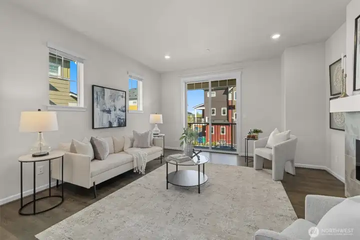 The living room opens to a private balcony