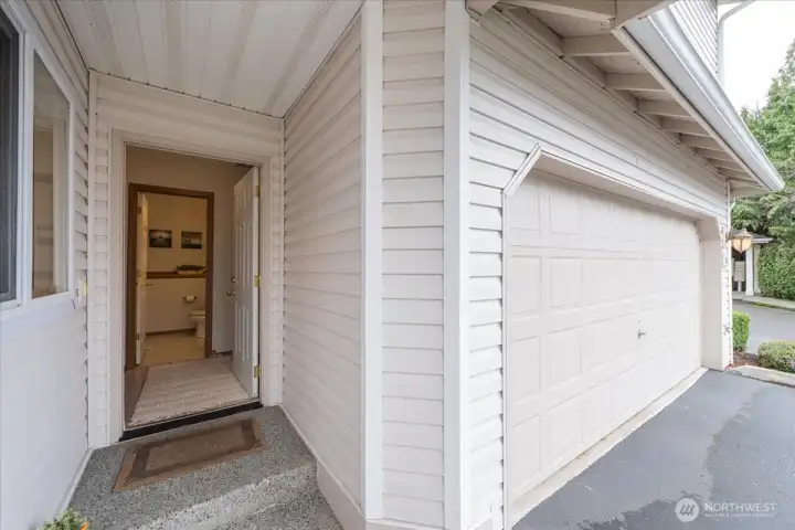 Enter to the garage door on the right, 1/2 bath on main and to the left Kitchen, Living room and views of the green belt.