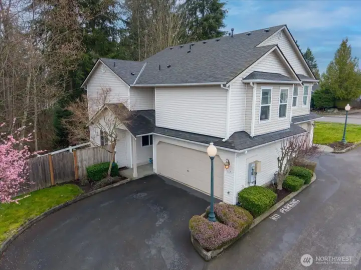 Lots of parking with guest spots on the other side the of flowering pink tree. Home faces Northwest.