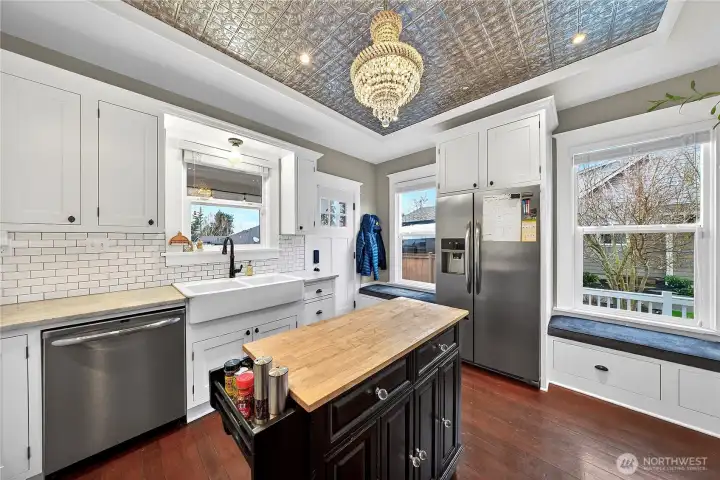 Stainless appliances and function kitchen island with butcher block.