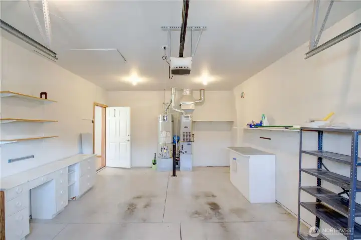 One car garage has storage shelving