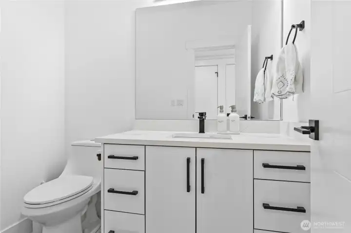 Hall bathroom between garage and kitchen