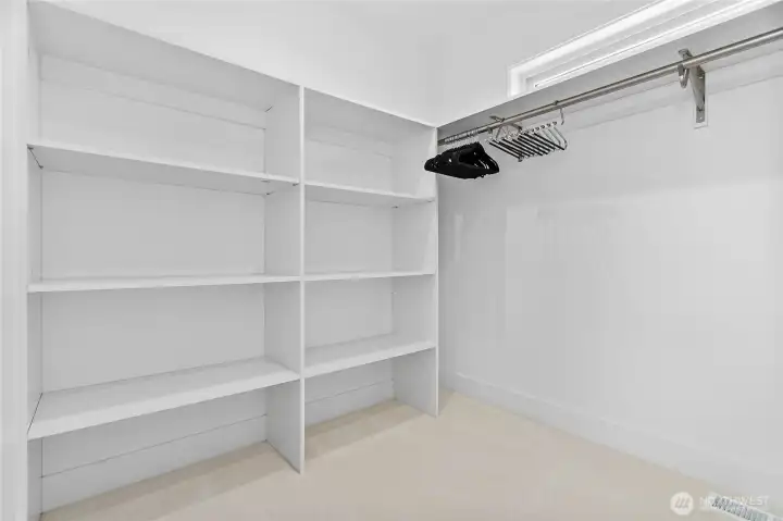 Downstairs primary walk in closet