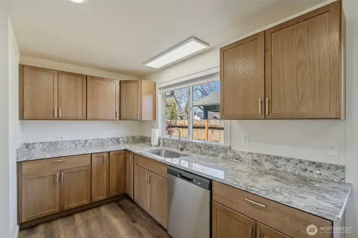 Granite tops even wrap the window sill.