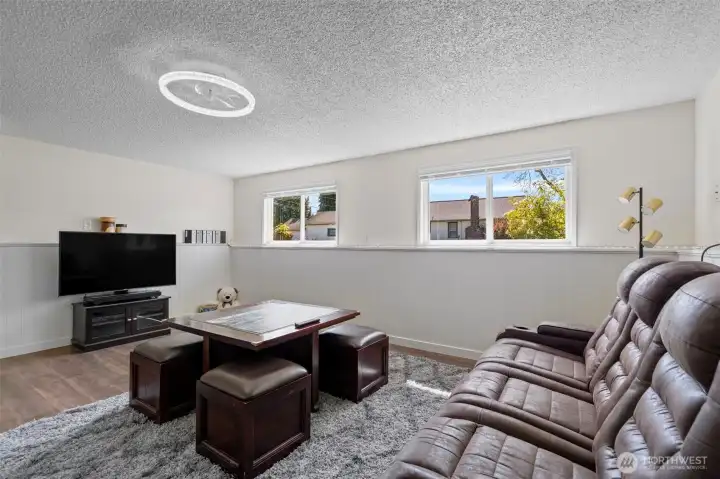 Large windows keep the lower level light & bright.