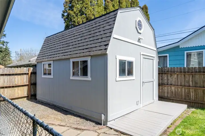 Barn-style shop has new trex deck ramp for easy access.