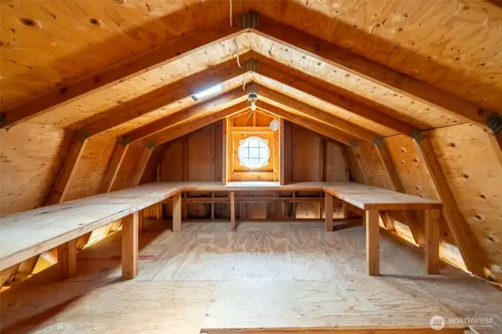 Top loft area of shed with wrap around shelves.