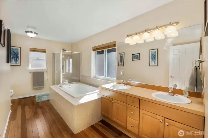 Large Fresh N Clean 5 Piece Attached Primary Bathroom . Gleaming Cherry Hardwoods !