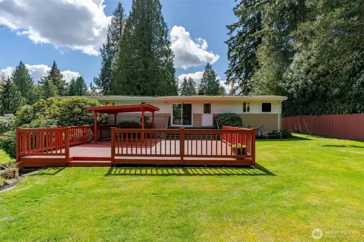 Expansive entertainment deck with covered area for year round BBQ's.