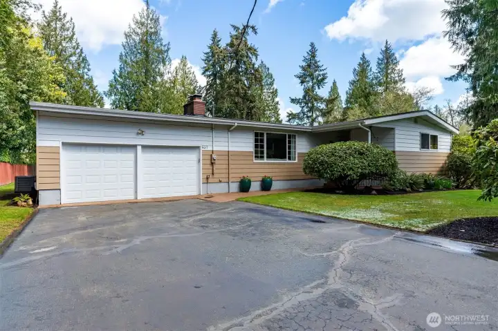 Spacious two car garage with storage and easy to maintain aluminum siding.