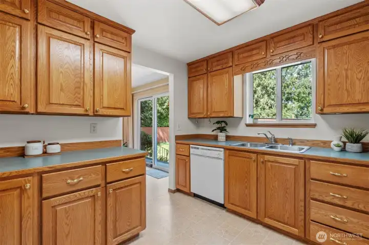 Kitchen is light, bright, and has easy access to the deck. It's also in great shape and so well cared for.