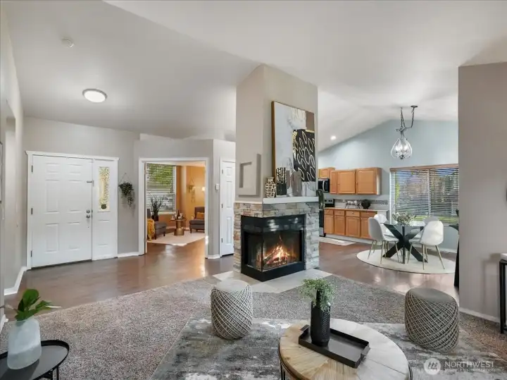 Stunning dual-sided fireplace in living and dining areas.
