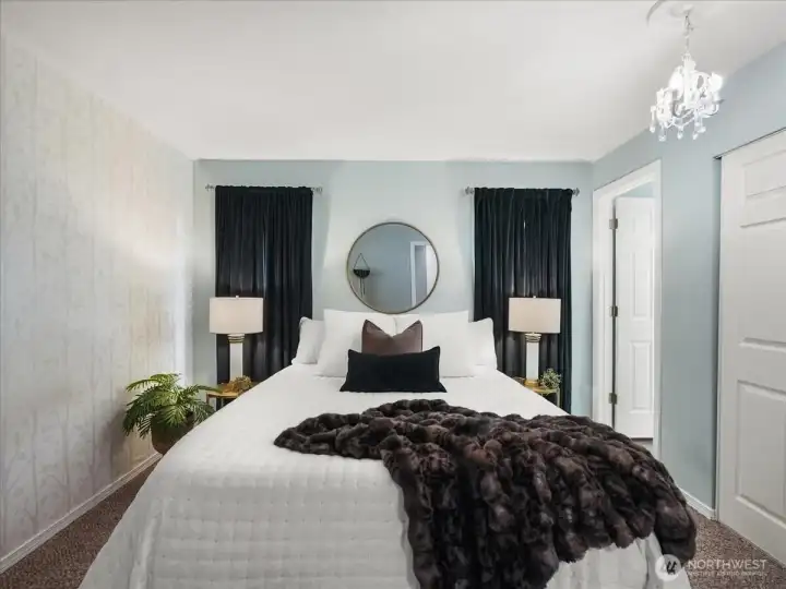 Primary suite features stylish finishes and tiled shower details.