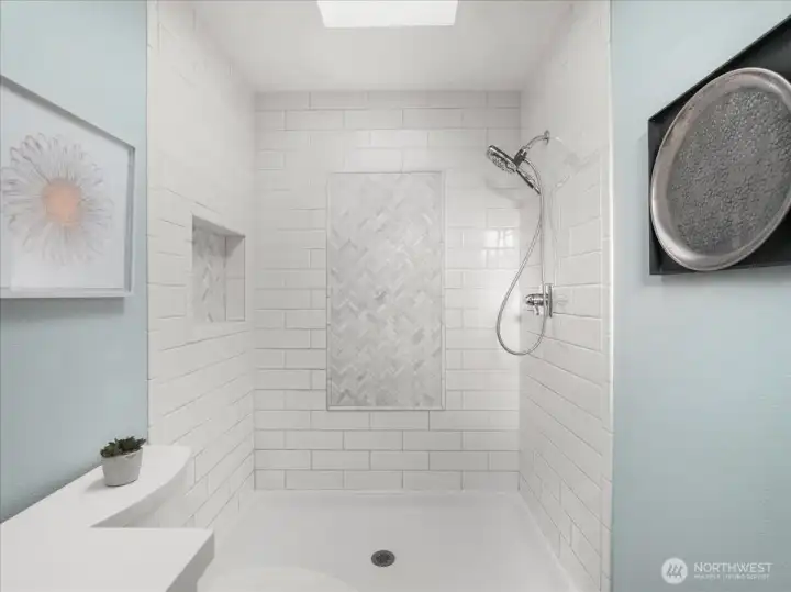 Bathrooms feature subway tile and chevron-pattern tile details.