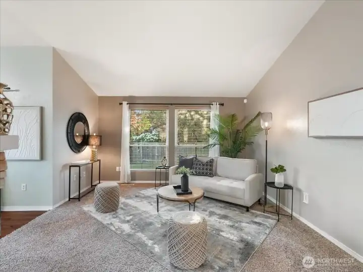 Open-concept living room creates a bright and connected gathering space.