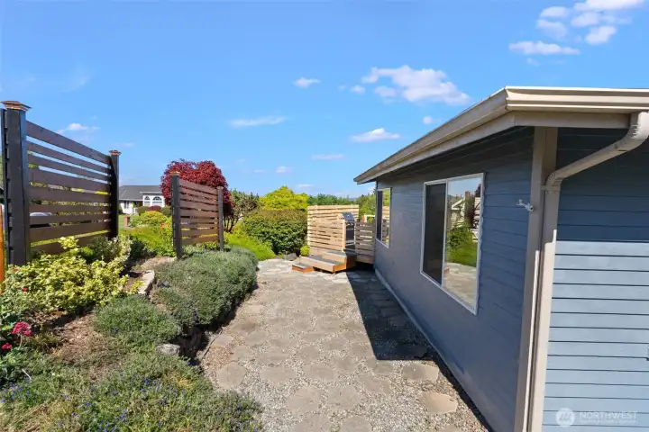 Side yard view with lovely landscaping