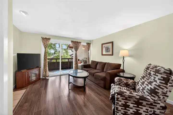 Living Room    Bright and inviting living room with abundant natural light, open-concept layout, and seamless flow to the dining area and private outdoor space. Perfect for entertaining, relaxing, or working from home, this comfortable gathering space features modern finishes, updated flooring, and a cozy atmosphere buyers are searching for in today’s condo market.