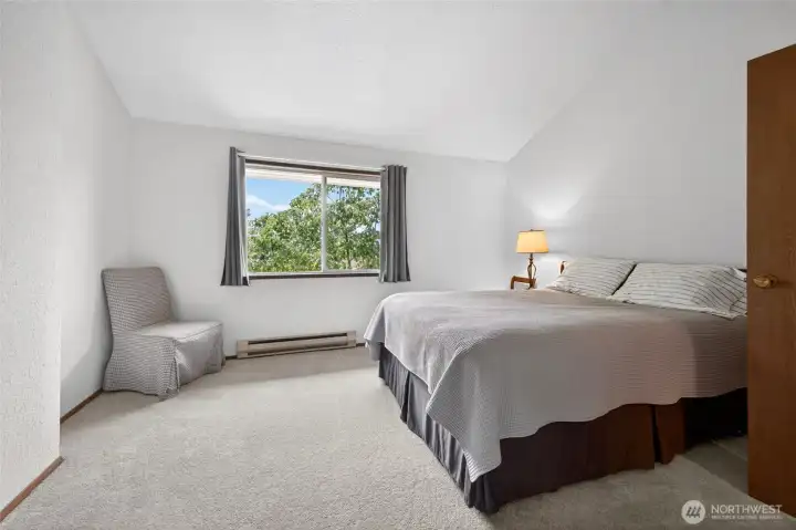 Primary Bedroom    Spacious primary suite offering privacy, comfort, and generous closet space. Large windows create a light-filled retreat with room for a king-sized bed, additional seating, or home office setup. Ideal for buyers seeking a relaxing primary bedroom with functional storage and flexible living options.