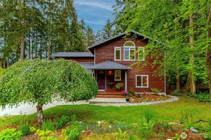 Charming home, nicely landscaped. notice the paths around the home.