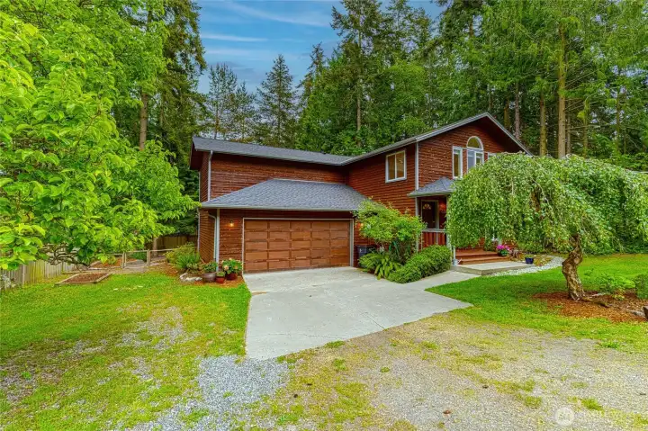 2 car garage with off street parking, partially fenced, pear tree and easy care landscaping.