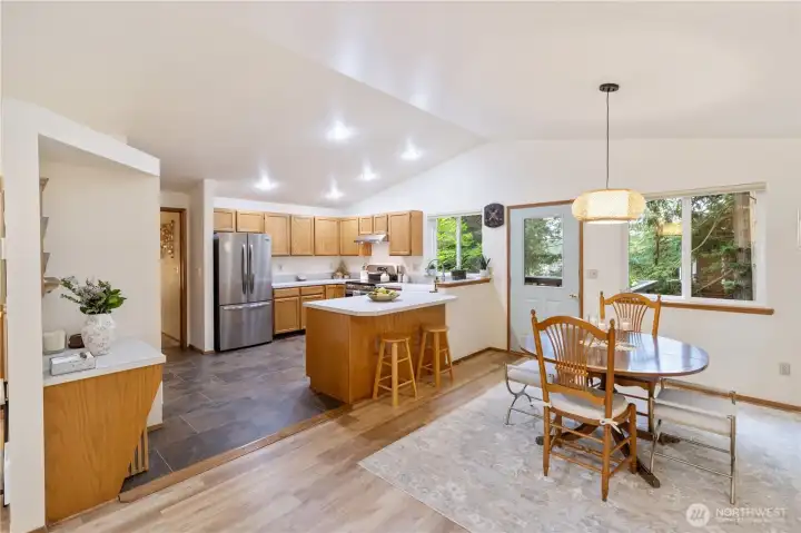 Notice the small desk as you enter the kitchen. New vinyl plank flooring in the dining area and laminate tile in the kitchen.
