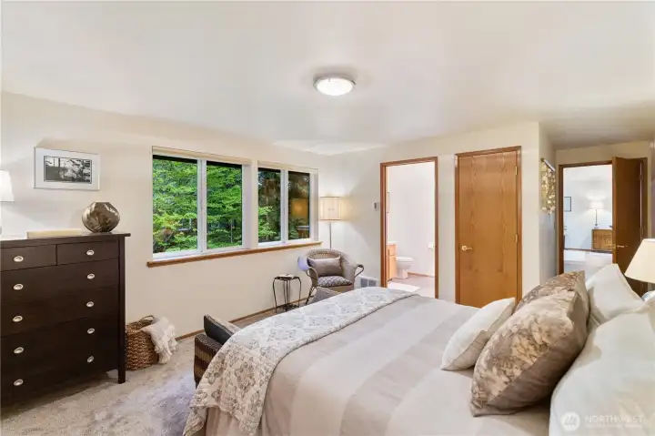 The door on the right leads to the kitchen and the door on the left is the primary bath with jetted tub.